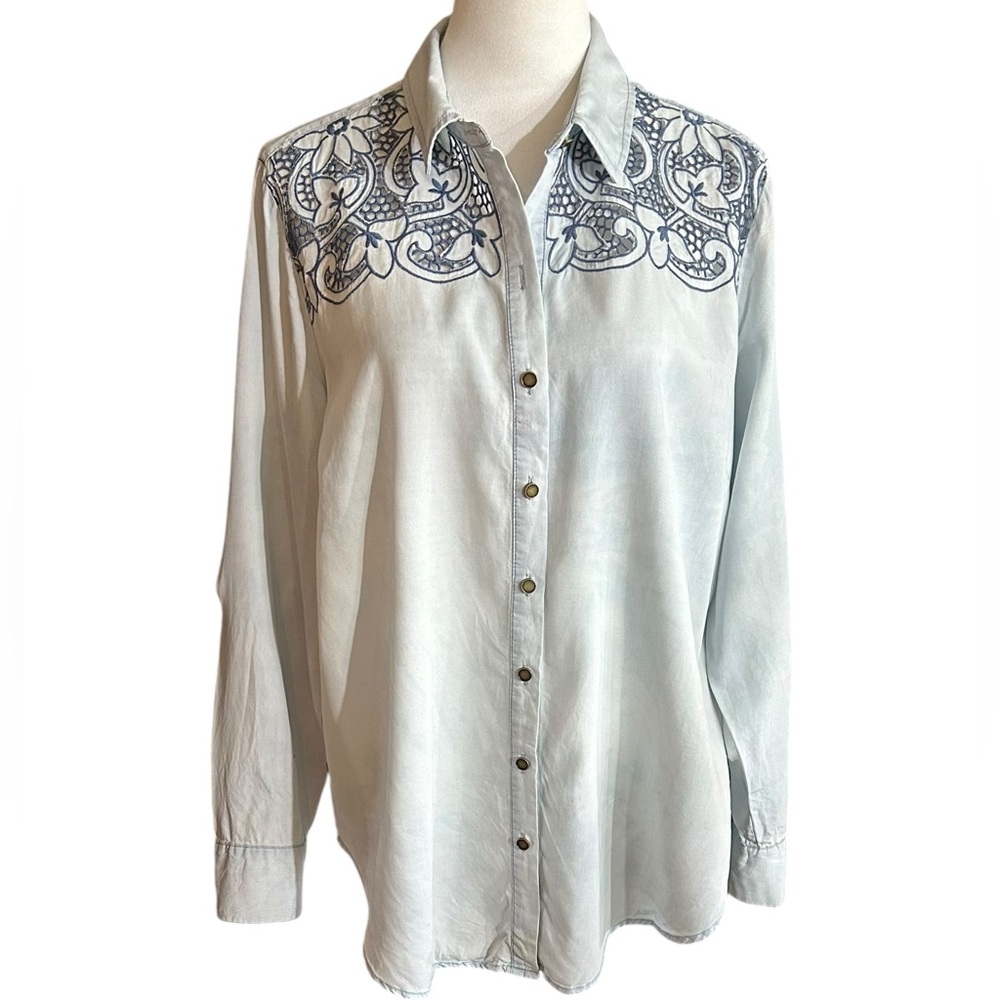 A very pretty Ariat shirt with intricate open stitch work on the front.